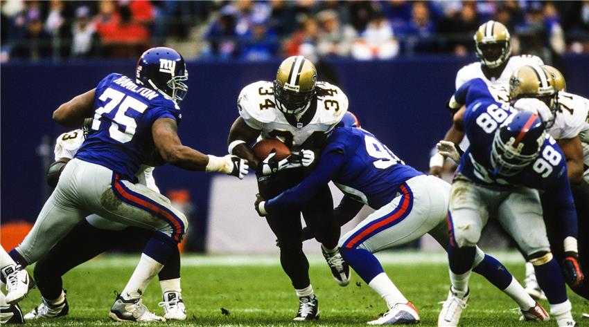 Dallas Cowboys cornerback Deion Sanders hoists the Vince Lombardi